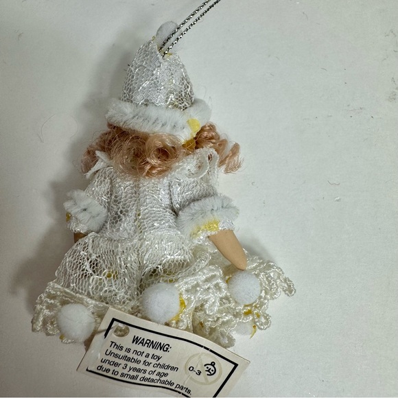 NWT. 7 porcelain doll ornaments. 5 of little girl and 2 of baby. - Picture 10 of 14